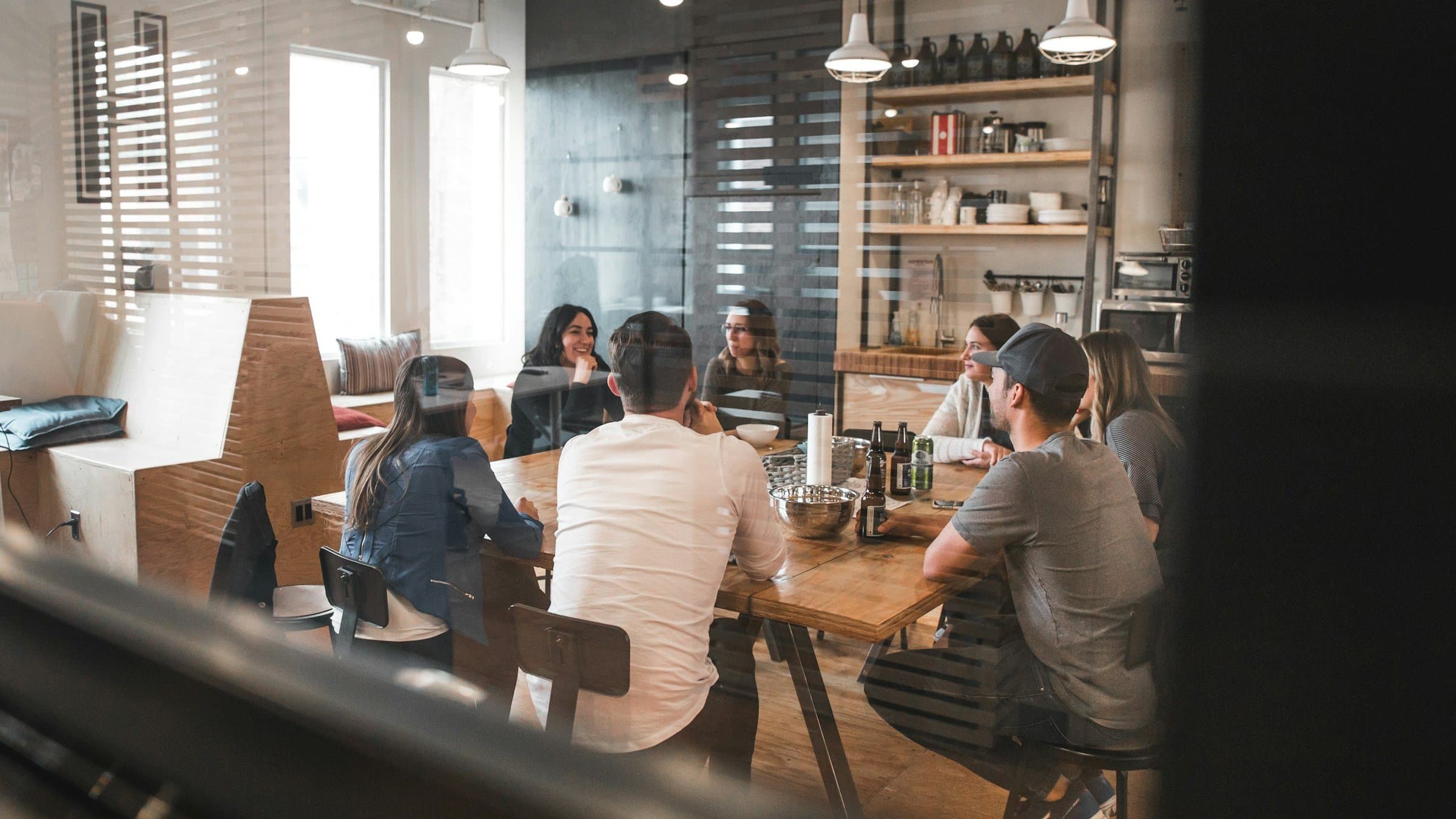 Colleagues meeting around a table in a modern office
