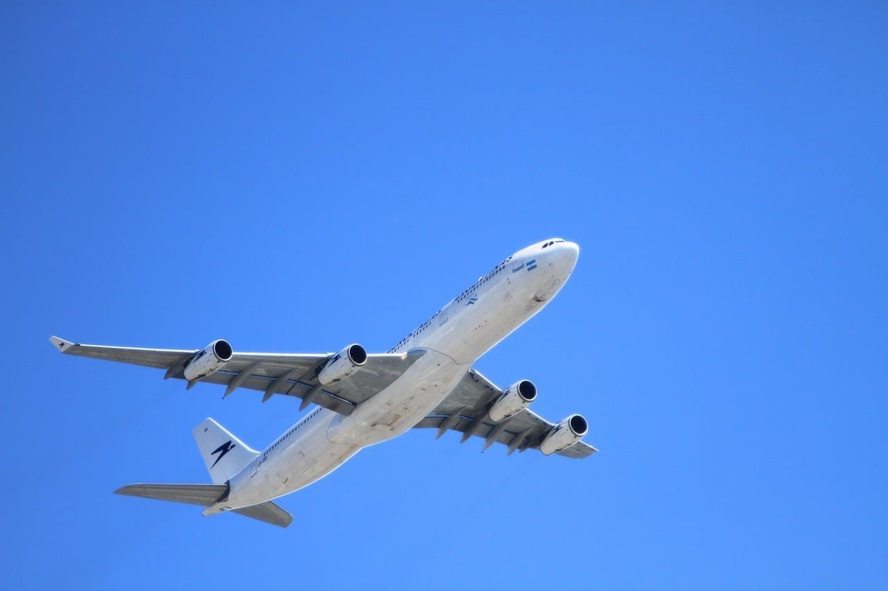 A passenger plane flying in a clear blue sky