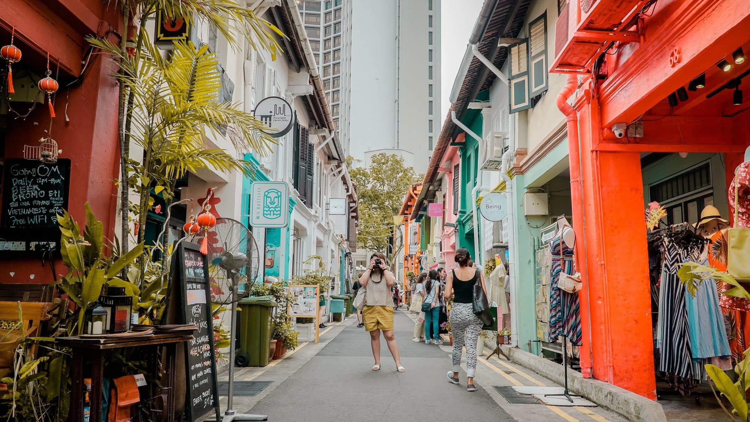 A colourful shophouse lane lined with shops